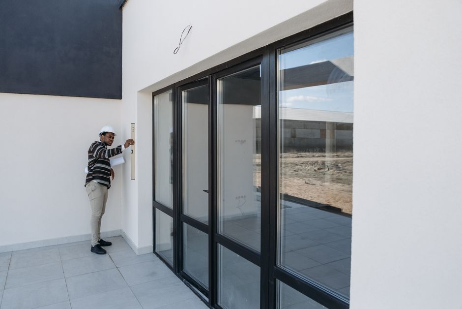 Professional contractor carefully installing a wooden interior door