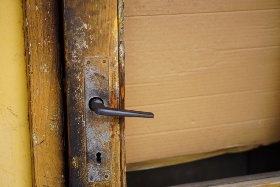 Close up of a secure metal door handle and lock mechanism